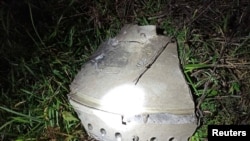 The debris, which the locals claim to be that of a missile, is pictured at the site of an explosion in Przewodow, a village in eastern Poland near the border with Ukraine, Nov. 16, 2022.