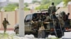 FILE - Somali soldiers are seen riding on a pick-up truck in Mogadishu, Somalia, April 27, 2022. 
