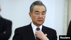 Direktur Kantor Komisi Luar Negeri Pusat China Wang Yi di Kremlin di Moskow, Rusia 21 Maret 2023. (Sputnik/Sergei Karpukhin/Pool via REUTERS)