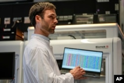 Dr. Axel Schmidt shows the genome of world famous composer Ludwig van Beethoven on a computer screen during an interview with The Associated Press in Bonn, Germany, Tuesday, March 21, 2023. (AP Photo/Martin Meissner)