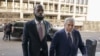 Atis Ayisyen-Ameriken Prakazrel (Pras) Michel ki te manm gwoup Fugees la, ak avoka li David Kenner rive nan tribinal federal Washington nan 30 Mas 2023, pou ouveti pwose li. 