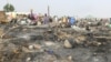 Vue générale des destructions causées par un incendie dans le camp de Muna Alamdiri, près de Maiduguri, le 15 novembre 2023. (Photo Audu MARTE / AFP)