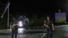 Sejumlah petugas kepolisian berjaga di sebuah jalan dekat Desa Banjska, utara Kosovo, setelah 30 pria bersenjata menembak mati seorang polisi Kosovo Albania dan menyerbu sebuah biara Kristen Ortodoks, Minggu, 24 September 2023. (Foto: Bojan Slavkovic/AP Photo)
