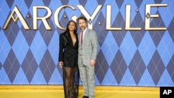 Ariana DeBose, left, Sam Rockwell pose for photographers upon arrival at the World premiere of the film 'Argylle,' in London, Britain, Jan. 24, 2024. (Scott A. Garfitt/Invision/AP)