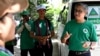 In this photo taken on July 4, 2023, Yeng Virak (R), president of Cambodia's Grassroots Democratic Party (GDP) speaks to members of his party during the general election campaign in Phnom Penh.