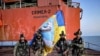 This undated handout photograph posted Sept. 11, 2023, on the Telegram account of the Defence Intelligence of the Ministry of Defence of Ukraine reportedly shows Ukrainian military members on an oil and gas drilling platform in the Black Sea. 