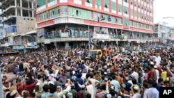 Afghan cricket fans celebrate their team's victory during the men's T20 World Cup cricket match between Afghanistan and Bangladesh, in the city of Khost province eastern of Afghanistan, June. 25, 2024.