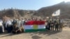 بەشێک لە حاجیانی هەرێمی کوردستان بە ئاڵای کوردستانەوە لە بەرامبەر کێوی ئوحد وەستاون. وێنەکەی هی بەڕێوەبەرایەتی گشتی حەج و عومرەى کوردستانە و 5ی شەشی 2024 بڵاوکراوەتەوە.
