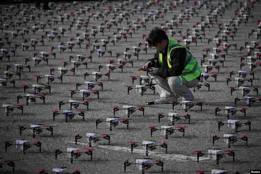 A staff member checks a drone before the World Drone Light Show 2024, which is part of the 2024 Korea Drone Expo, in Incheon, South Korea.
