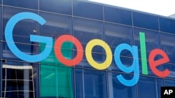 FILE - A Google sign is seen on a building at the company's campus in Mountain View, California, Sept. 24, 2019. 