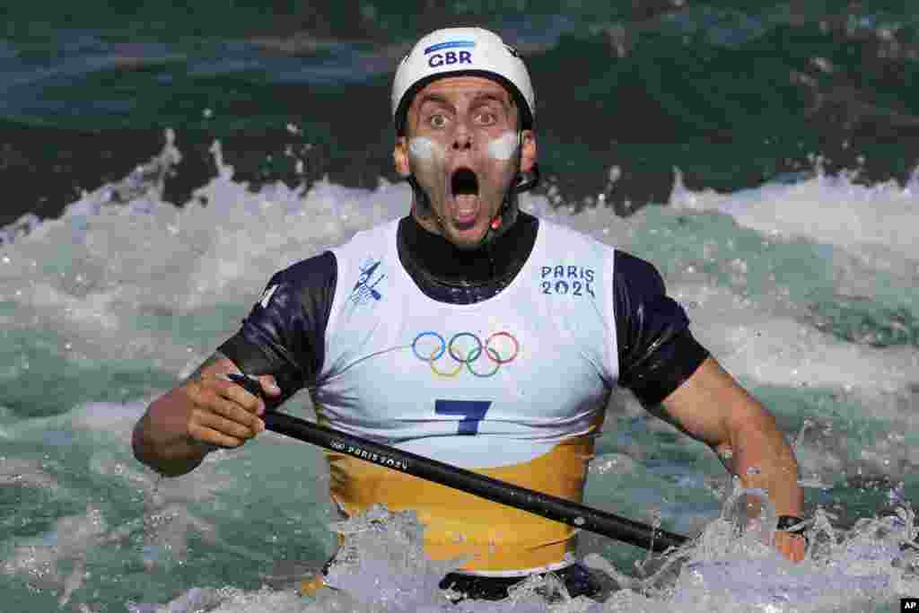 Adam Burgess of Britain reacts at the finish line of the men's canoe single finals during the canoe slalom at the 2024 Summer Olympics in Vaires-sur-Marne, France.
