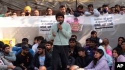 FILE - Bajrang Punia, Indian wrestler who won a Bronze medal at the 2020 Tokyo Olympics, addresses the media during a protest against Wrestling Federation of India President Brijbhushan Sharan Singh and other officials in New Delhi, India, Jan. 20, 2023. 