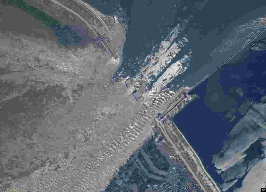 This satellite image provided by Planet Labs PBC shows an overview of the damage at the Kakhovka dam in southern Ukraine, June 6, 2023.