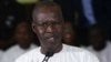 Le Premier ministre sénégalais, Mahammed Buon Abdallah Dionne, annonçant la réélection du président Macky Sal, le 25 février 2019 à Dakar. (Photo SEYLLOU / AFP)
