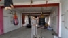কাবুলের মেল্লাত বক্সিং ক্লাবে বিস্ফোরণের ঘটনার এক দিন পর সেখানে এক আফগান নাগরিক সরঞ্জাম পরীক্ষা করছেন (২৭ অক্টোবর, ২০২৩) 