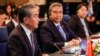 韩国外长朴振(中)和日本外相林芳正(右)听取中国最高外交主管王毅在雅加达举行的东盟会议上发表讲话。（2023 年7月13日）