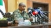FILE - This handout image posted on the Sudanese Armed Forces's Facebook page on Aug. 24, 2024, shows Gen. Abdel Fattah al-Burhan giving a press conference in Port Sudan, in the Red Sea state.