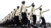 FILE - Members of Nigeria's military march at the inauguration of Nigerian President Bola Tinubu, at Eagle Square in Abuja, Nigeria, May 29, 2023. 