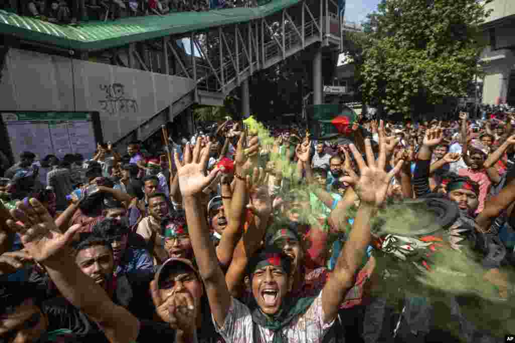 Protesters shout slogans as they celebrate Prime Minister Sheikh Hasina's resignation, in Dhaka, Aug. 5, 2024.