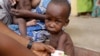 FILE- A doctor attends to a malnourished child at a refugee camp in Yola, Nigeria, May 3, 2015. Nigerian authorities declared a national emergency on food security July 13, 2023, as record inflation has made basic foods unaffordable for many. 