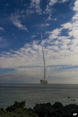 FILE - In this photo provided by South Korea Defense Ministry, the third test flight of solid-fuel space rocket is launched from a barge in waters near Jeju Island, South Korea, Monday, Dec. 4, 2023. (South Korea Defense Ministry via AP)