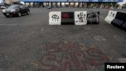 FILE - The words "End Sars," referring to the Special Anti-Robbery Squad police unit, are written near the Lekki toll gate, in Lagos, Nigeria, Oct. 24, 2020. 