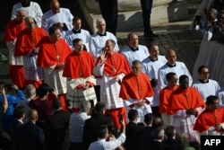Future cardinals arrive for a ceremony to create 21 new cardinals at St. Peter's Square in The Vatican on September 30, 2023. (Photo by Filippo MONTEFORTE / AFP)