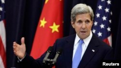 U.S. Secretary of State John Kerry (R) during the U.S.-China Strategic and Economic Dialogue (S&ED) Joint Opening Session at the State Department in Washington, July 10, 2013. 