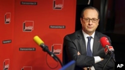 French President Francois Hollande is seen taking a question during an interview with radio station France Inter in Paris Jan. 5, 2015.
