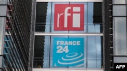 FILE - The headquarters of French national audiovisual media company group France Medias Monde (FMM), display signage for Radio France Internationale (RFI) and France 24, in Issy-les-Moulineaux, near Paris, April 9, 2019. Burkina Faso has suspended broadcasts by RFI.