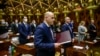 The new prime minister of North Macedonia, Social Democratic leader Dimitar Kovacevski (C), takes his oath in the North Macedonian Parliament building, in Skopje, Jan 16, 2022. 