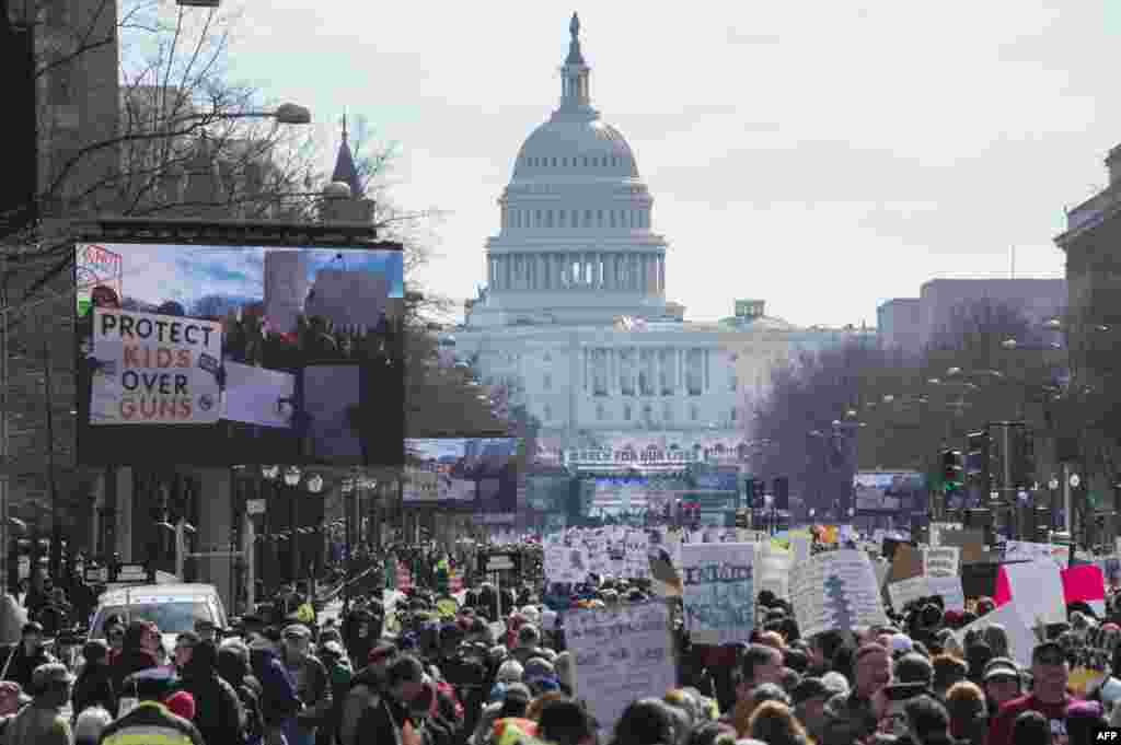 Participants take part in the "March for Our Lives" rally in Washington, DC on March 24, 2018. (AFP PHOTO / ANDREW CABALLERO-REYNOLDS)