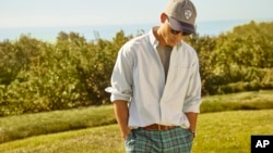 This photo provided by Brooks Brothers shows a model showing a Brooks Brothers casual office wardrobe. (Matt Albiani/Brooks Brothers via AP)