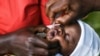 FILE - A baby receives a polio vaccine in Lilongwe, Malawi, March 20, 2022. In neighboring Mozambique, health authorities on May 18, 2022, declared an outbreak of wild poliovirus after confirming that a child in the country's Tete province had contracted the disease.