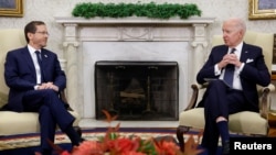 U.S. President Joe Biden meets with Israeli President Isaac Herzog in the Oval Office at the White House in Washington, Oct. 26, 2022. 