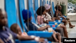 FILE - Patients receive treatment for cholera at the Gheskio Center Hospital supported by UNICEF in Port-au-Prince, Haiti, Oct. 14, 2022.