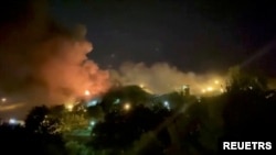 Asap mengepul dari Penjara Evin di Teheran, Iran, 15 Oktober 2022 dalam gambar diam ini diambil dari video yang diperoleh Reuters.