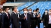 Prime Minister Hun Sen gestures next to China's Foreign Minister Wang Yi as they attend a handover ceremony at the Morodok Techo National Stadium, which will be the main venue for Cambodia’s 2023 SEA Games, in Phnom Penh, Cambodia, September 12, 2021. REUTERS