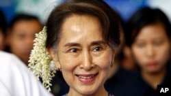 FILE - In this Dec. 14, 2018, file photo, ousted Myanmar leader Aung San Suu Kyi arrives to attend the Myanmar Entrepreneurship Summit at the Myanmar International Convention Center in Naypyidaw, Myanmar. (AP Photo/Aung Shine Oo, File)
