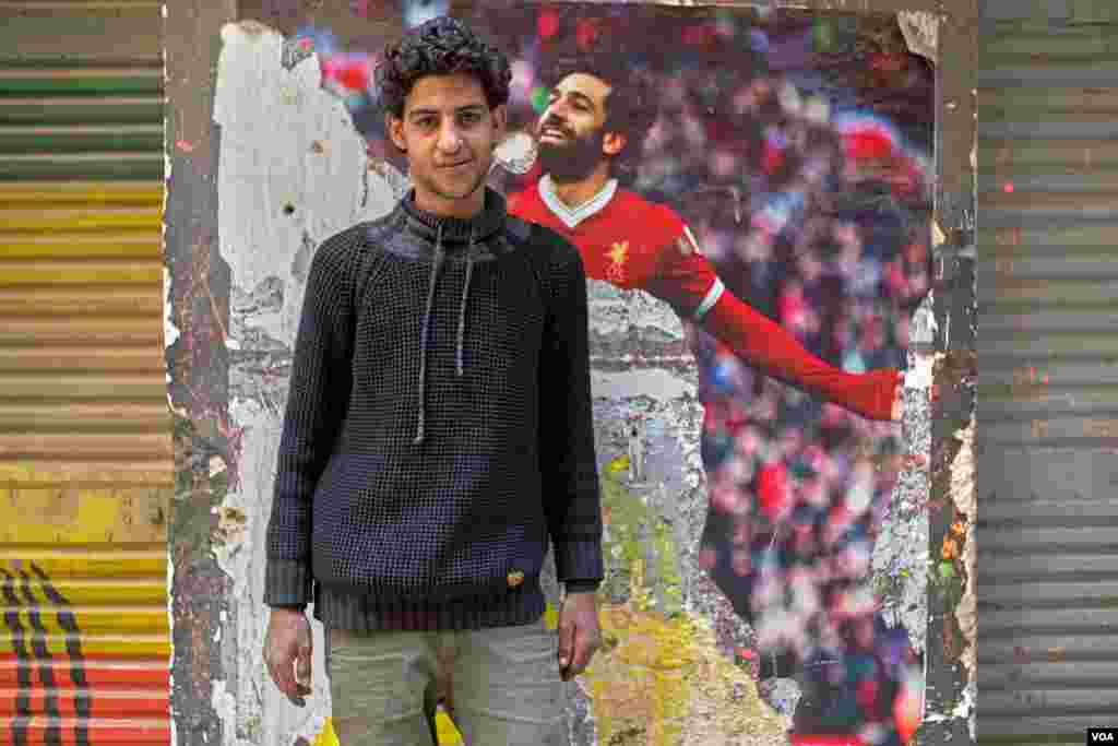 Abdullah, 24, used to work as a plumber, but now dreams of getting his toktok. He says, "my dream was to be a football player like Mo Salah, but the reality is that I want to buy my toktok, decorate it, and make a stable income." (H. Elrasam/VOA)