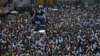 Protesters led by the art community demand the resignation of Haitian President Jovenel Moise as they march through Port-au-Prince, Haiti, Oct. 13, 2019.