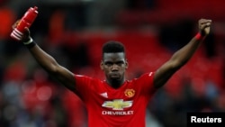 Paul Pogba dari Manchester United melakukan selebrasi di penghujung pertandingan, 13 Januari 2019. (Foto: REUTERS/Eddie Keogh)