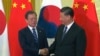 文在寅会晤习近平，双方同意努力恢复两国关系 