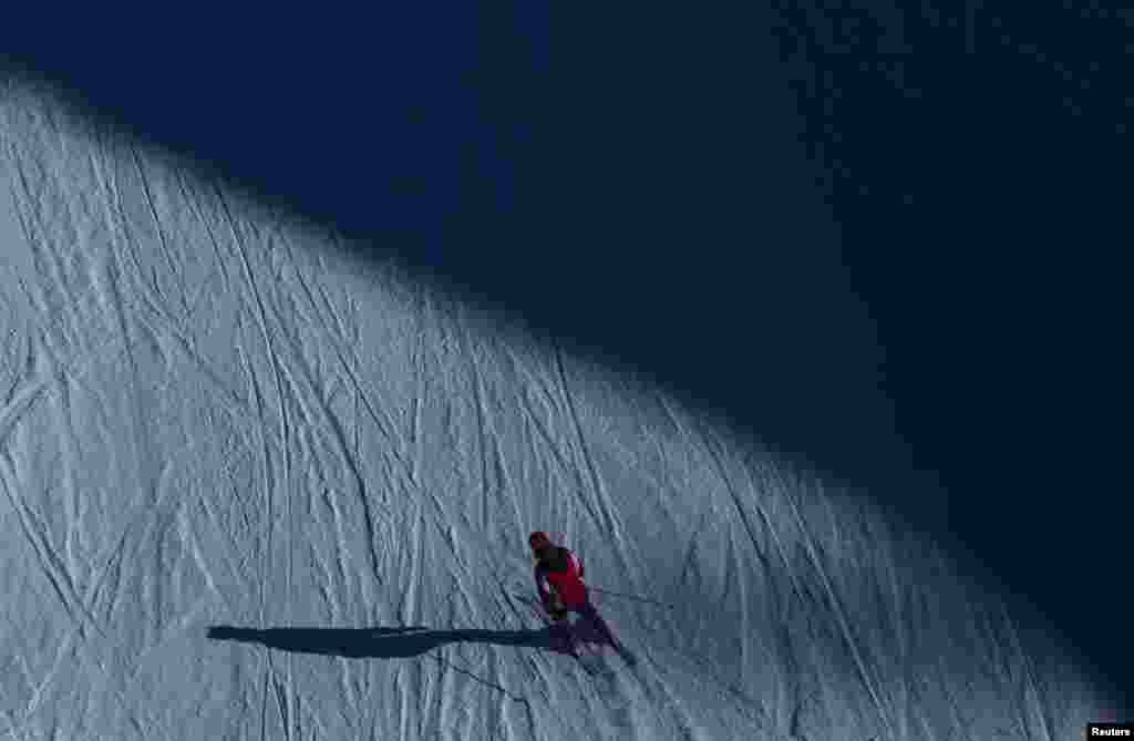 A visitor skies down a slope near the resort of Krasnaya Polyana, near Sochi, Russia.