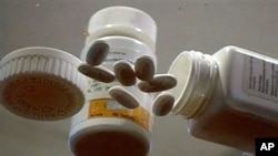 Samples of Nevirapine, an antiretroviral AIDS drug used since the 1990s, are displayed at the National Institutes of Health in Memphis, Tenn. (AP Photo/APTN)
