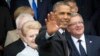 U.S. President Barack Obama, center, waves as he arrives for a group photo during a NATO summit at the Celtic Manor Resort in Newport, Wales, Sept. 4, 2014.