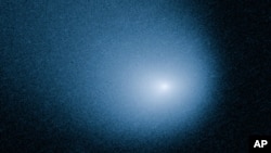 Komet Siding Spring yang ditangkap Teleskop Antariksa Hubble milik NASA. 