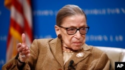 FILE - U.S. Supreme Court Associate Justice Ruth Bader Ginsburg speaks during a discussion on the 100th anniversary of the ratification of the 19th Amendment at Georgetown University Law Center in Washington, Feb. 10, 2020.