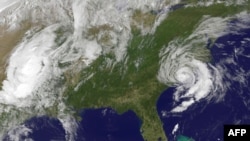 FILE - This May 10, 2015 NOAA satellite photo shows Tropical Storm Ana (R) off the Carolinas. Ana made landfall on the US southeastern coast risking flooding, high winds and life-threatening tides in the region.