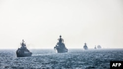 Picha ya Tovuti ya Jeshi la Iranian January, 21 2022 ikionyesha Manowari za Iran, Russia, and China katika mazoezi ya kijeshi na pia yaliyohusisha mazoezi ya jeshi la angani na majini. (Photo by Iranian Army office / AFP)-